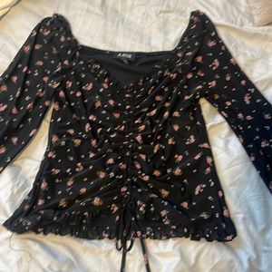 A cute floral blouse, size medium, barely worn